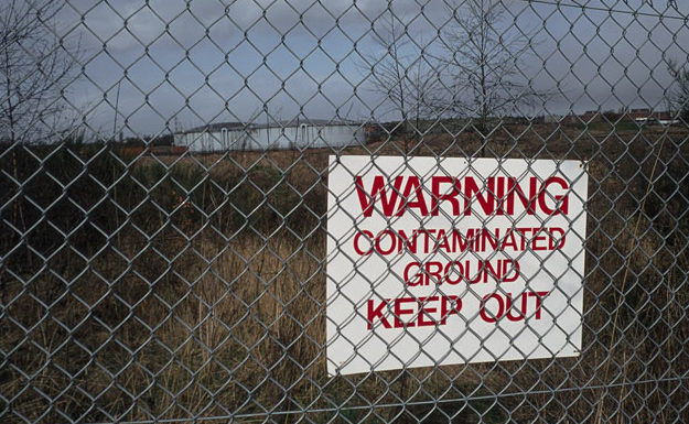 warning contaminated ground keep out sign
